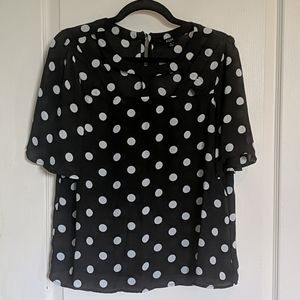 Short sleeve polka dot top with cite cut outs